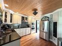 Modern kitchen with stainless steel appliances, granite countertops, and custom backsplash at 1400 Yates St, Orlando, FL 32804