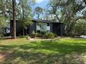 Condo exterior features green spaces, mature trees and easy access to units at 190 Riverbend Dr # 102, Altamonte Springs, FL 32714