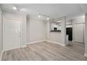 Spacious living room featuring gray-toned wood-look flooring and neutral wall paint at 206 E South St # 6007, Orlando, FL 32801