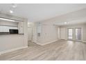 Open concept living room with a view of the kitchen, providing ample space at 206 E South St # 6007, Orlando, FL 32801