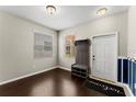 Bright foyer features hardwood floors, coat rack with shoe storage, and a welcoming ambiance at 3426 Schoolhouse Rd, Harmony, FL 34773