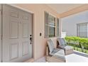 Inviting front porch with seating offers a cozy spot to enjoy the outdoors at 3426 Schoolhouse Rd, Harmony, FL 34773