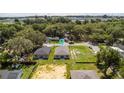 An aerial shot shows the property with a large lot, neighborhood, and view of the surrounding area at 3678 Rollin O Ln, Apopka, FL 32703