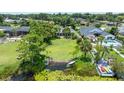 Aerial view of home with expansive yard, lake access, and a serene waterfront lifestyle at 8473 Granada Blvd, Orlando, FL 32836