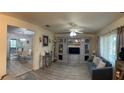 Bright living room features wood flooring, large windows, and comfortable seating at 114 Madeira Ave, Orlando, FL 32825