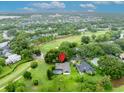 Beautiful aerial view of a well-maintained home overlooking a golf course at 1507 Golfside Dr, Winter Park, FL 32792