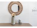 Stylish interior decor with mirror, vase, and decorative fish at 2363 Lancashire St, Davenport, FL 33896