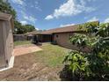 Back yard featuring a storage shed and a screened-in porch at 2842 Blind Owl Dr, Orlando, FL 32822