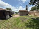 Back yard featuring a storage shed and a wooden privacy fence at 2842 Blind Owl Dr, Orlando, FL 32822