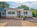 Charming single-Gathering home featuring neutral siding, stone accents, and a welcoming front entrance at 3637 Dubsdread Cir, Orlando, FL 32804