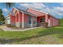 Charming one-story home featuring brick accents, lush landscaping, and a well-maintained lawn at 4700 Prairie Point Blvd, Kissimmee, FL 34746