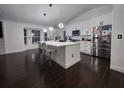 Bright kitchen featuring white cabinets, stainless appliances, and a large center island at 4760 Ohio Ave, Sanford, FL 32771