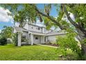 Inviting two-story home featuring well-maintained lawn and lush landscaping at 478 Chicago Woods Cir, Orlando, FL 32824