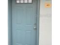 The building's blue-painted door is marked with unit number 40 at 4830 S Conway Rd # 40, Orlando, FL 32812