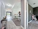 Spacious hallway and dining area, featuring neutral tones and access to the outdoor patio at 4993 Southlawn Ave, Orlando, FL 32811