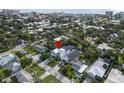 Aerial view of neighborhood showcasing the home's location among mature trees and other residential properties at 507 S Pine St, New Smyrna Beach, FL 32169