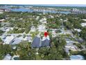 An aerial view of neighborhood showcasing the home's location near the water and local businesses at 507 S Pine St, New Smyrna Beach, FL 32169