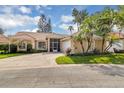 Charming single-story home with an attached two-car garage and screened front entrance at 625 Nighthawk Cir, Winter Springs, FL 32708