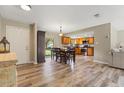 Dining area open to kitchen with hardwood floors, plenty of space and natural lighting at 897 Shed St, Oviedo, FL 32765