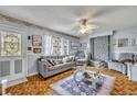 Cozy living room featuring comfortable seating, complemented by abundant natural light and decorative accents for added warmth at 906 25Th Nw St, Winter Haven, FL 33881