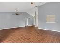 Spacious living room featuring hardwood flooring, ceiling fans and a large open space at 9833 Tattersall Ave, Orlando, FL 32817