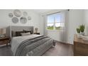 Bright bedroom with a large window, stylish decor, and comfortable furnishings at 1207 Normandy Dr, Haines City, FL 33844