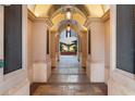 Arched walkway to courtyard with fountain, dining and lounge seating at 140 E Morse Blvd # J, Winter Park, FL 32789