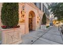 Stone building entrance with wrought iron gate and manicured landscaping at 140 E Morse Blvd # J, Winter Park, FL 32789