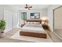 Cozy bedroom features a ceiling fan, natural light, and large closet at 1404 Oak Pl # A, Apopka, FL 32712