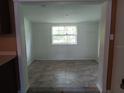 Bright, open room with tile flooring and a window providing natural light at 2103 Mantilla Ave, Orlando, FL 32811