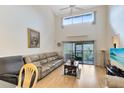 Living room featuring natural light, comfortable seating, and a view of the screened porch at 3336 Gray Fox Cv # 3336, Apopka, FL 32703