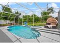 Beautiful in-ground screened pool with outdoor lounge, perfect for relaxing and enjoying the Florida sunshine at 701 Little Hampton Ln, Gotha, FL 34734