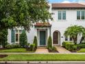 Inviting townhomes feature brick walkways, mature trees, and lush landscaping at 8818 Bismarck Palm Dr, Winter Garden, FL 34787