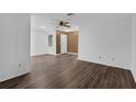 This welcoming living room features hard wood floors and fresh paint at 101 Grand Plaza Dr # A40, Orange City, FL 32763