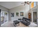 The living room features high ceilings and large windows allowing ample natural light at 1051 S Highland St # 5E, Mount Dora, FL 32757