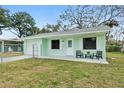 Charming home with a fenced front yard, a covered entry, and a freshly painted exterior at 124 Oak Ridge Ave, Edgewater, FL 32132