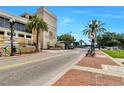 Scenic street view of The Metropolitan at Lake Eola with beautiful palm trees at 151 E Washington St # 5B, Orlando, FL 32801