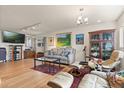 Cozy living room with hardwood floors, recessed lighting, and eclectic decor at 151 N Orlando Ave # 212, Winter Park, FL 32789