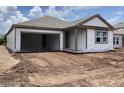 New home featuring an attached garage and gray vinyl siding at 2379 Broadbrook Drive, St Cloud, FL 34771
