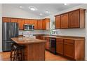 Spacious kitchen with hardwood floors, wooden cabinets, and a center island at 30926 County Road 435, Sorrento, FL 32776