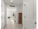 Hallway featuring tile flooring, neutral paint and decor at 3941 Willowbrook Dr, Edgewater, FL 32141