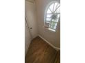 Staircase landing features wood-look flooring and natural light at 445 Fountainhead Cir # 262, Kissimmee, FL 34741