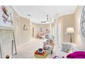 Bright living room with neutral colors, stylish furniture, tile flooring, and archways leading to other rooms at 449 Cruz Bay Cir, Winter Springs, FL 32708