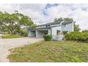 Charming townhome with covered parking, picket fence, and landscaped yard at 7475 Canford Ct # 21, Winter Park, FL 32792