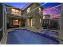 Relaxing screened-in pool area with a spa, and ample seating perfect for outdoor entertaining at 9227 Sommerset Hills Dr, Davenport, FL 33896