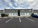 Exterior view of a multi-unit building with reserved parking spots in front at 1000 S Semoran Blvd # 608, Winter Park, FL 32792
