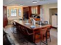 Spacious eat-in kitchen with oversized island and plenty of seating at 10012 Lake Louisa Rd, Clermont, FL 34711