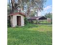 Outbuildings in the backyard need repairs and/or cleanup of the surrounding yard and landscaping at 10012 Lake Louisa Rd, Clermont, FL 34711