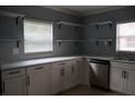 Bright kitchen featuring modern white cabinets, sleek countertops, and stainless steel appliances at 102 Luna Rd, Auburndale, FL 33823