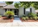 Charming single-story home featuring tidy landscaping, walkway, and a screened front entry at 1126 Villa Ln # 91, Apopka, FL 32712